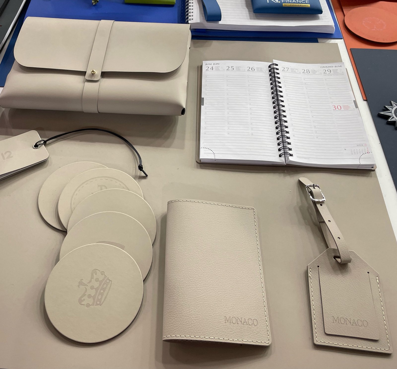 Luggage tag. passport holder, coaster, desk mat pouch in recycled leather